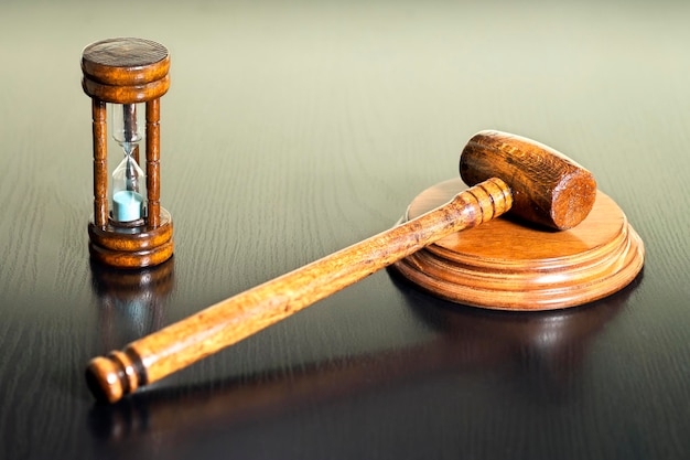 A gavel hitting a sound block in a courtroom, symbolizing the approval of debt relief legislation.