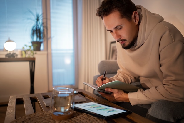 A person using a budgeting app on their phone to track expenses and manage finances, illustrating effective financial planning and avoiding debt.