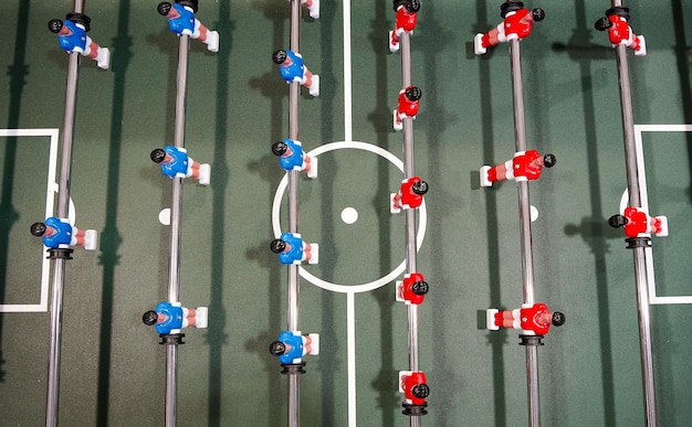 Overhead view of a handball court with players in different defensive formations, highlighting zones and player positioning. The image should be clear and show strategic player placement.