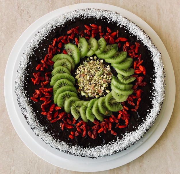 A top-down view of a plate with vegan brigadeiros and vegan cocada, arranged artfully. The focus is on the textures and colors of the sweets, highlighting the deliciousness of these vegan versions of classic Brazilian treats.